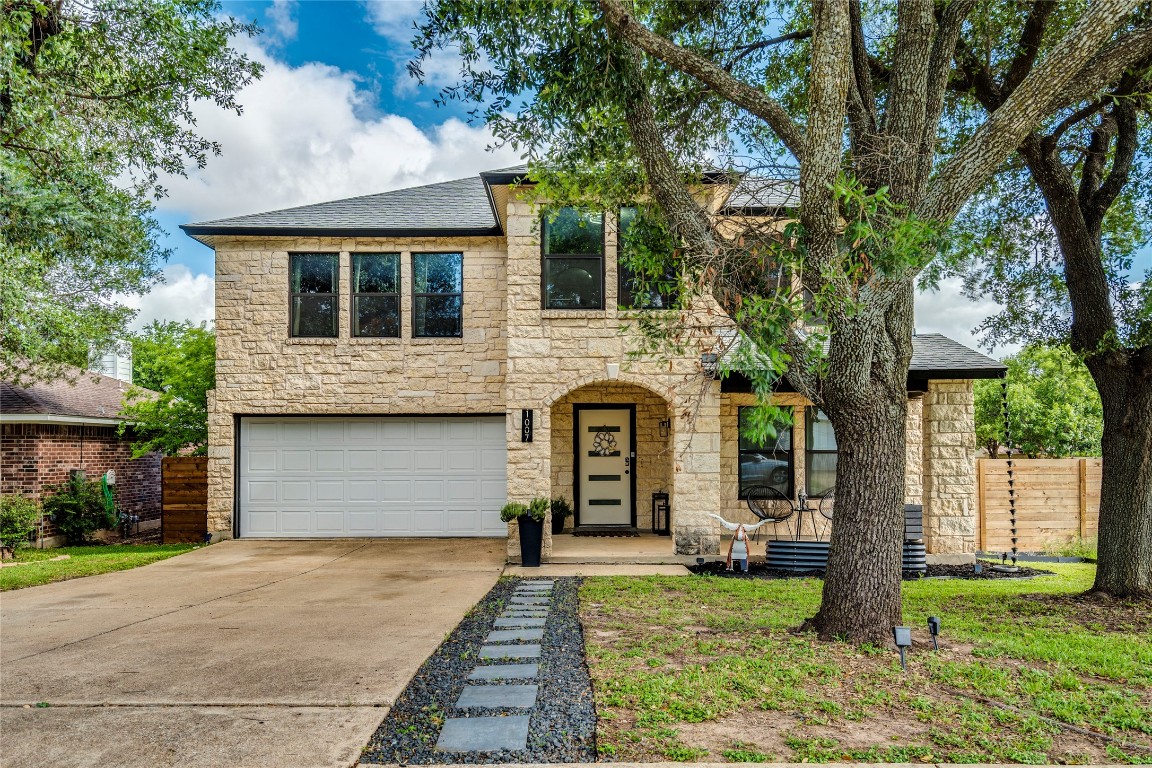 a front view of a house with garden