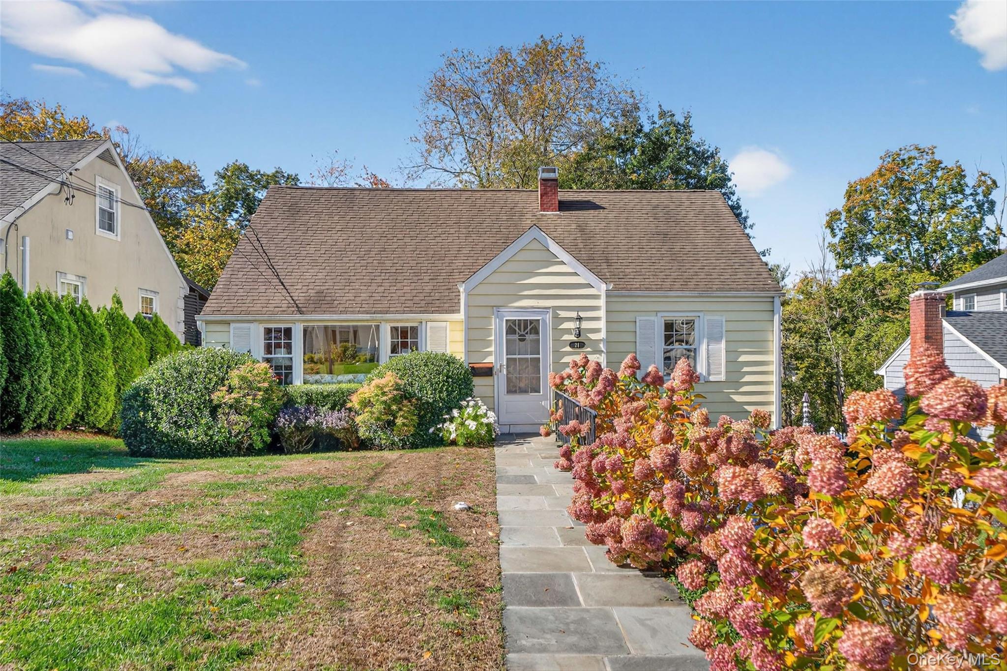 front view of a house with a yard