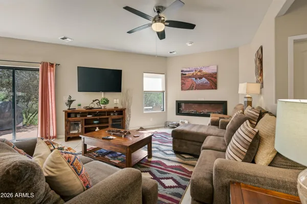 a view of a livingroom with furniture and a window