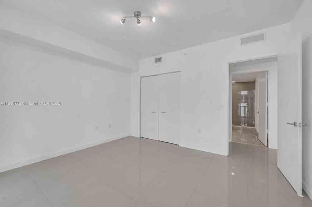 201 Southwest 17th Road, Unit 302 Miami, FL 33129 - Photo 11 of 27 wooden floor in an empty room