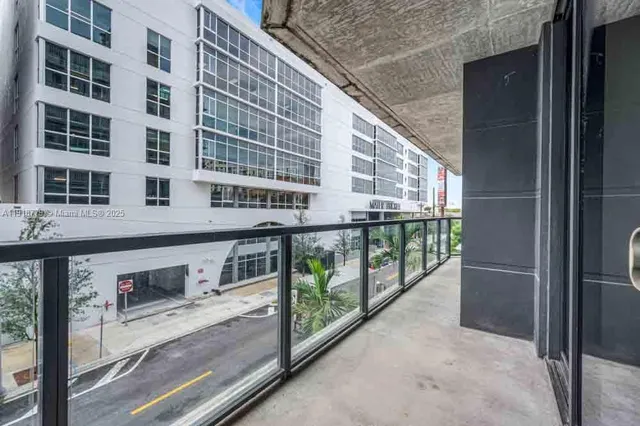 a balcony with street view and balcony