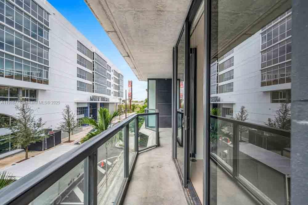 201 Southwest 17th Road, Unit 302 Miami, FL 33129 - Photo 20 of 27 a balcony with street view and balcony