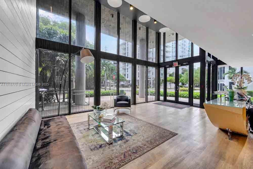 201 Southwest 17th Road, Unit 302 Miami, FL 33129 - Photo 24 of 27 a living room with furniture and a large window