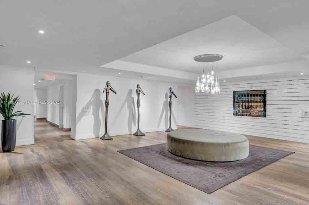 201 Southwest 17th Road, Unit 302 Miami, FL 33129 - Photo 25 of 27 a view of a living room and chandelier