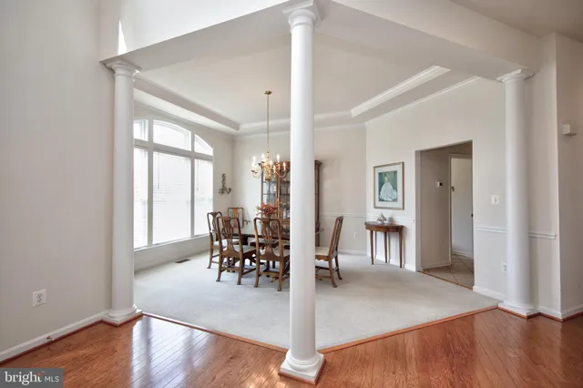 a view of a livingroom with furniture and hardwood floor