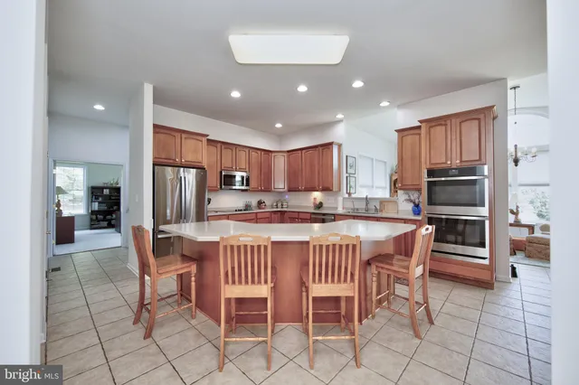 a dining room with furniture and a view of kitchen