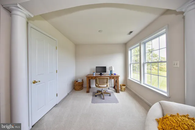 a bathroom with a double vanity sink mirror and toilet