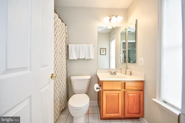 a view of entryway with wooden floor and window