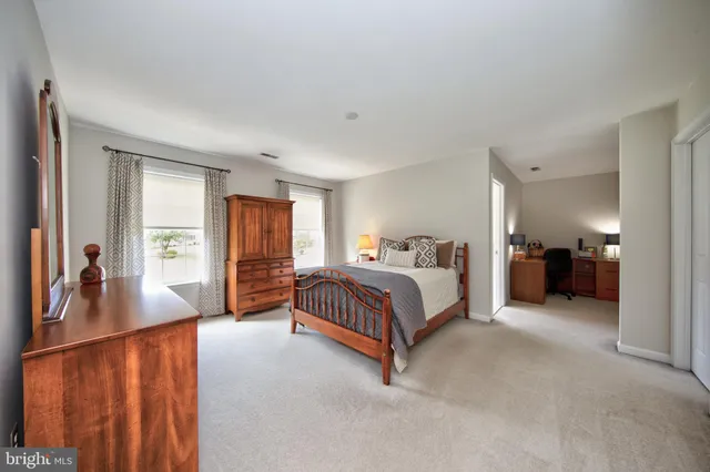 a view of a livingroom with furniture and a window