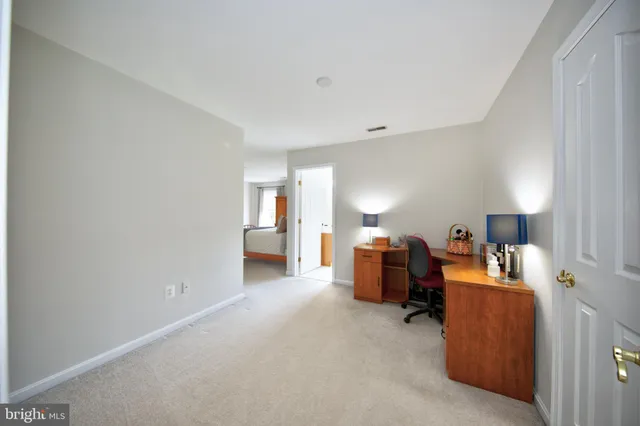a bathroom with a granite countertop sink and a bathtub