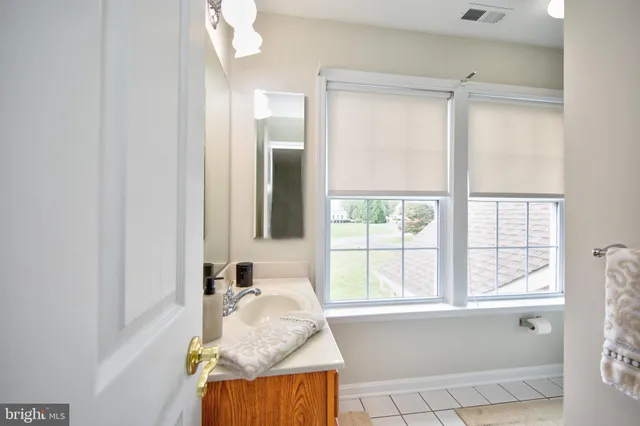 a bathroom with a shower curtain and a toilet