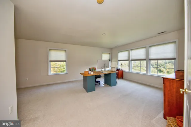 a view of a livingroom with furniture and window