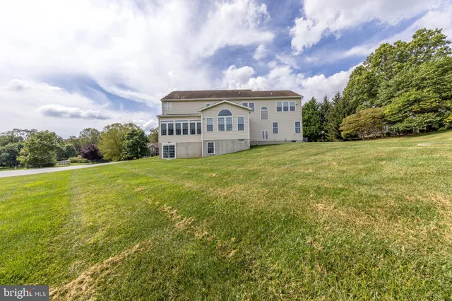 a view of a big yard with lots of green space