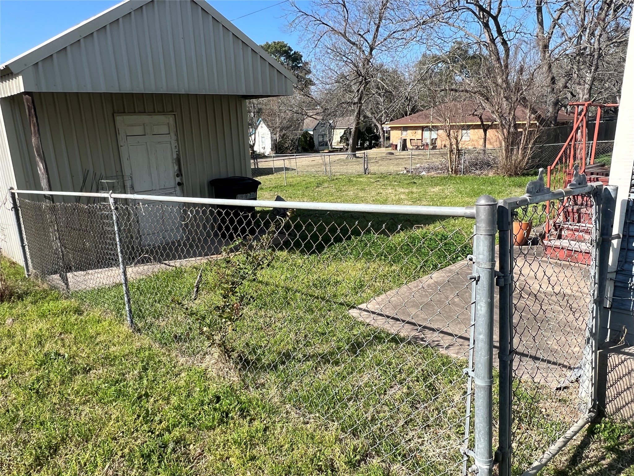 220 South Tesch Street Bellville, TX 77418 - Photo 12 of 14 a front view of a house with garden
