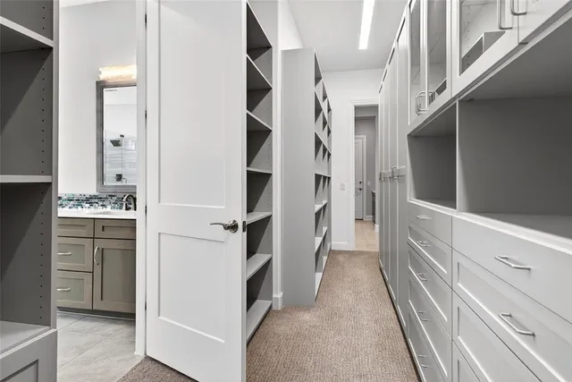 a view of walk in closet and window