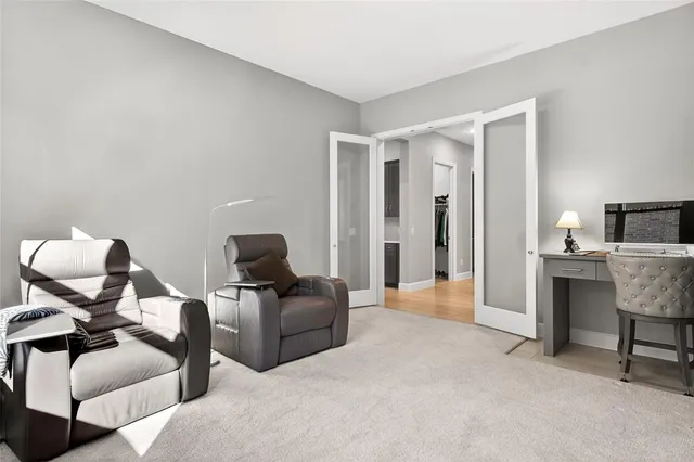 a living room with furniture and a lamp