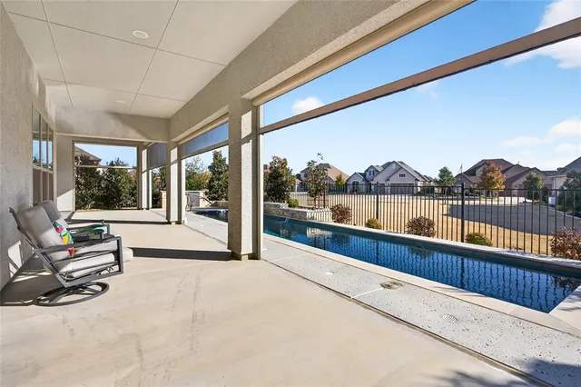 a view of a living room and balcony