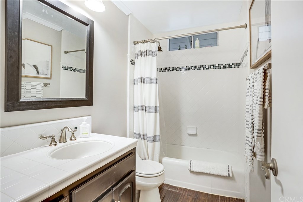 421 Gloucester Drive Costa Mesa, CA 92627 - Photo 16 of 30 Guest bath has shower over tub, custom tile work and fresh paint.