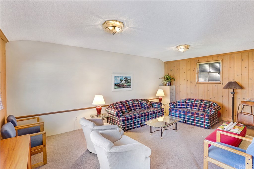 421 Gloucester Drive Costa Mesa, CA 92627 - Photo 24 of 30 Clubhouse family room / library has room to relax and 2 fireplaces.