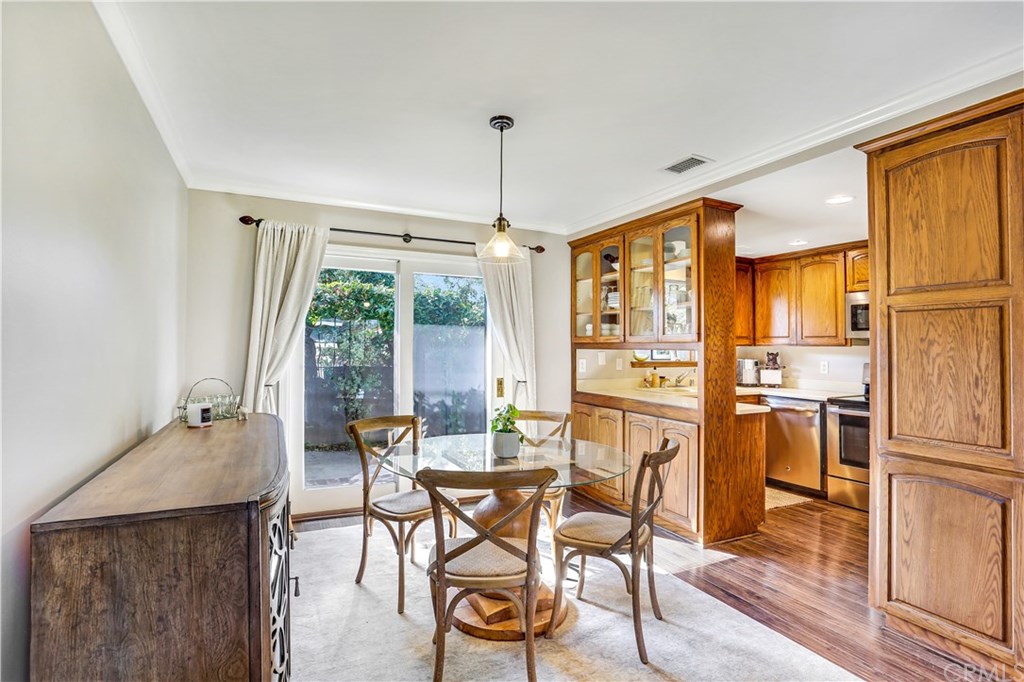 421 Gloucester Drive Costa Mesa, CA 92627 - Photo 7 of 30 Kitchen features tons of storage, stainless appliances and plenty of counter space.