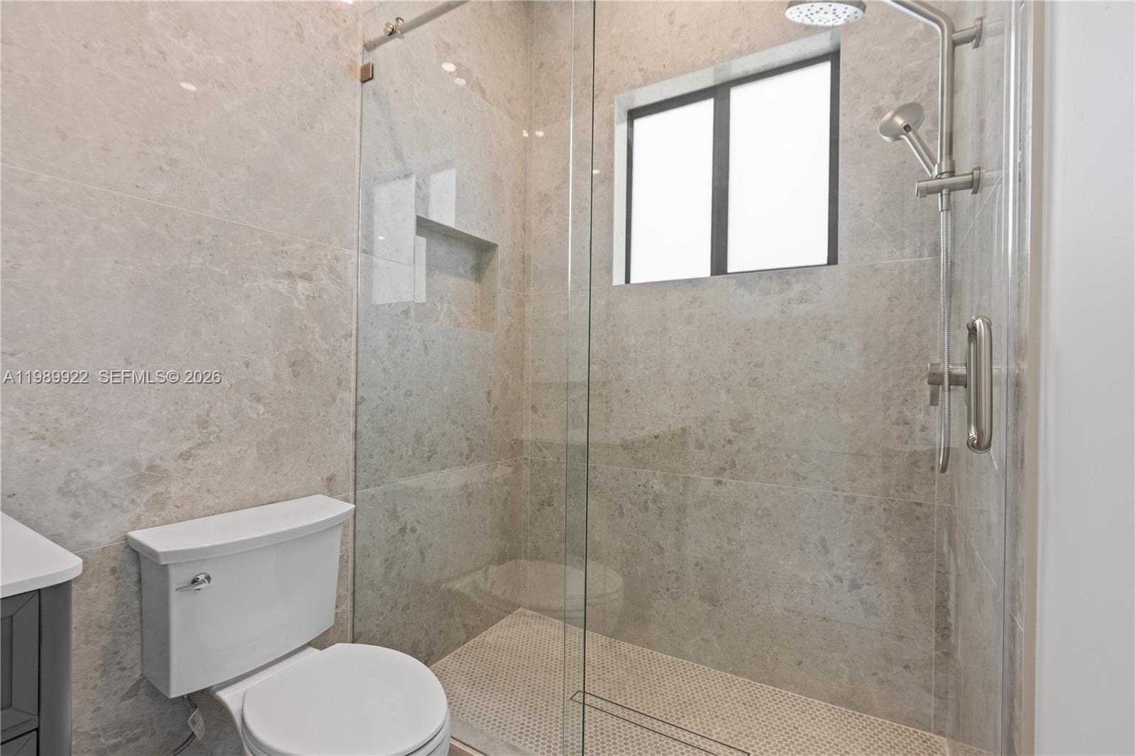 6221 Southwest 60th Street South Miami, FL 33143 - Photo 34 of 42 a bathroom with a toilet and a shower
