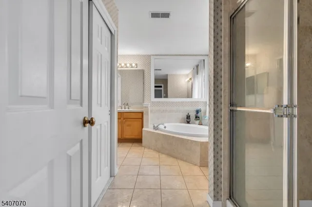 a bathroom with a bathtub and a sink