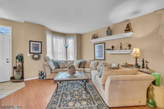 a living room with furniture and a rug
