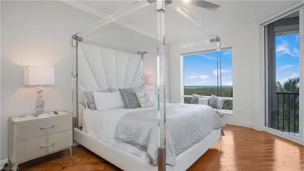 a bedroom with a bed and a lamp