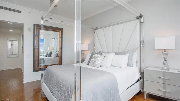 a bedroom with a bed and a television