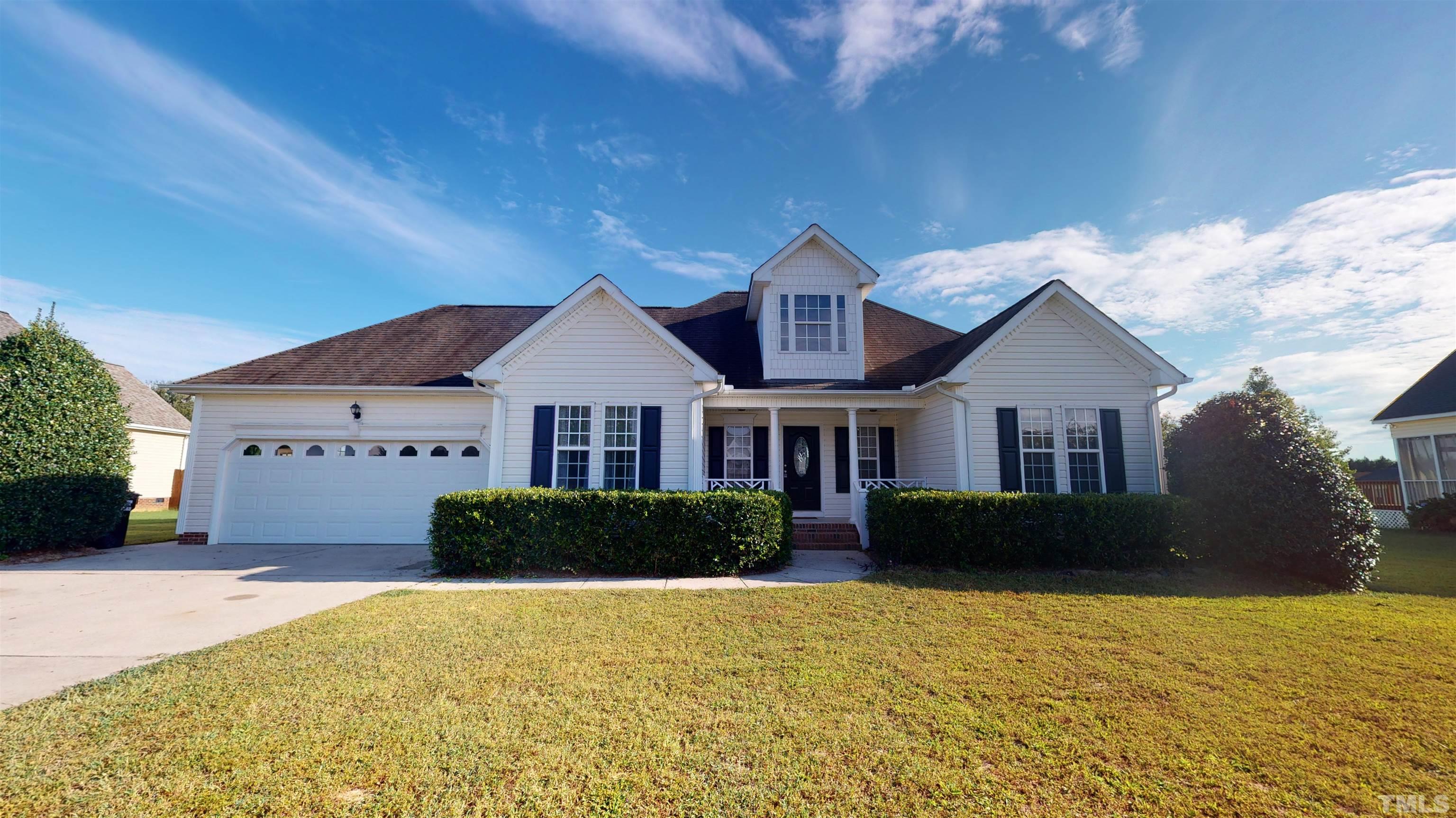 5016 Contender Drive Raleigh, NC 27603 - Photo 1 of 29 a front view of a house with a yard