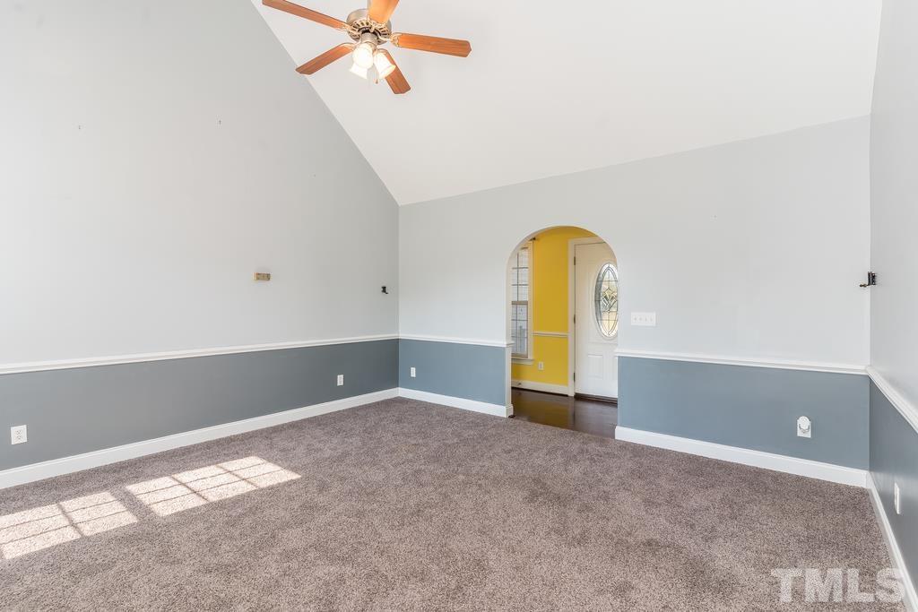 5016 Contender Drive Raleigh, NC 27603 - Photo 11 of 29 a view of a room with a hanging ceiling fan