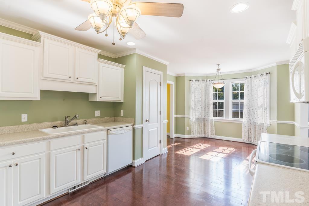 5016 Contender Drive Raleigh, NC 27603 - Photo 15 of 29 a kitchen with a sink cabinets and window