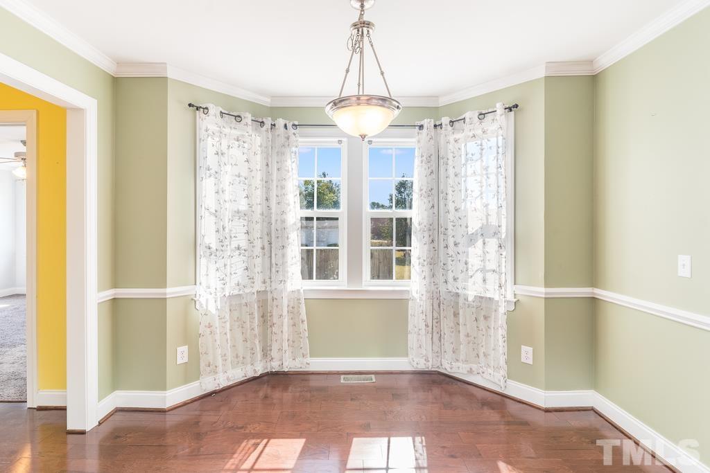 5016 Contender Drive Raleigh, NC 27603 - Photo 18 of 29 a view of an empty room with a window