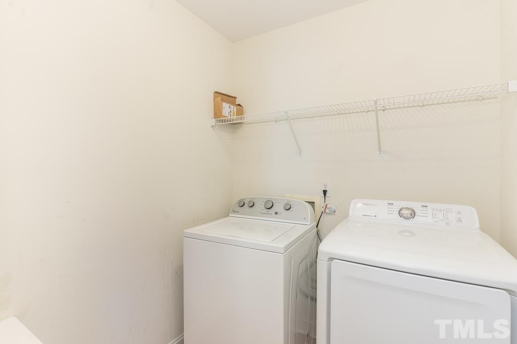 5016 Contender Drive Raleigh, NC 27603 - Photo 19 of 29 a utility room with dryer and washer