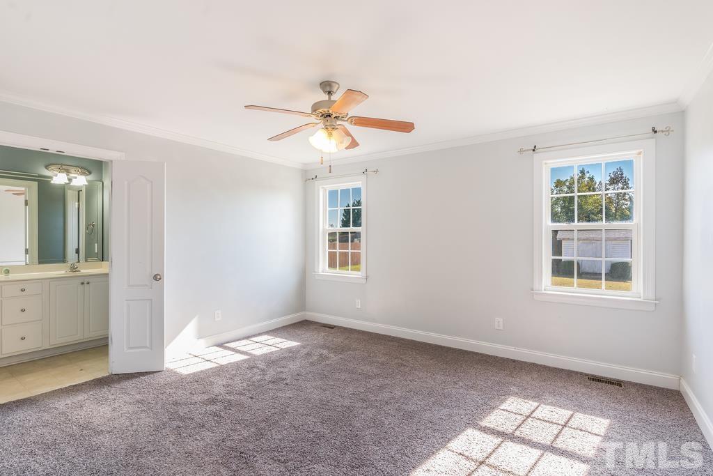 5016 Contender Drive Raleigh, NC 27603 - Photo 20 of 29 a view of an empty room with a window