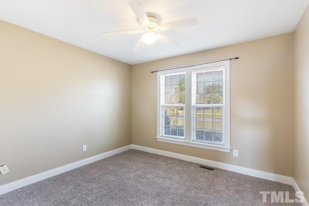 5016 Contender Drive Raleigh, NC 27603 - Photo 5 of 29 an empty room with a window