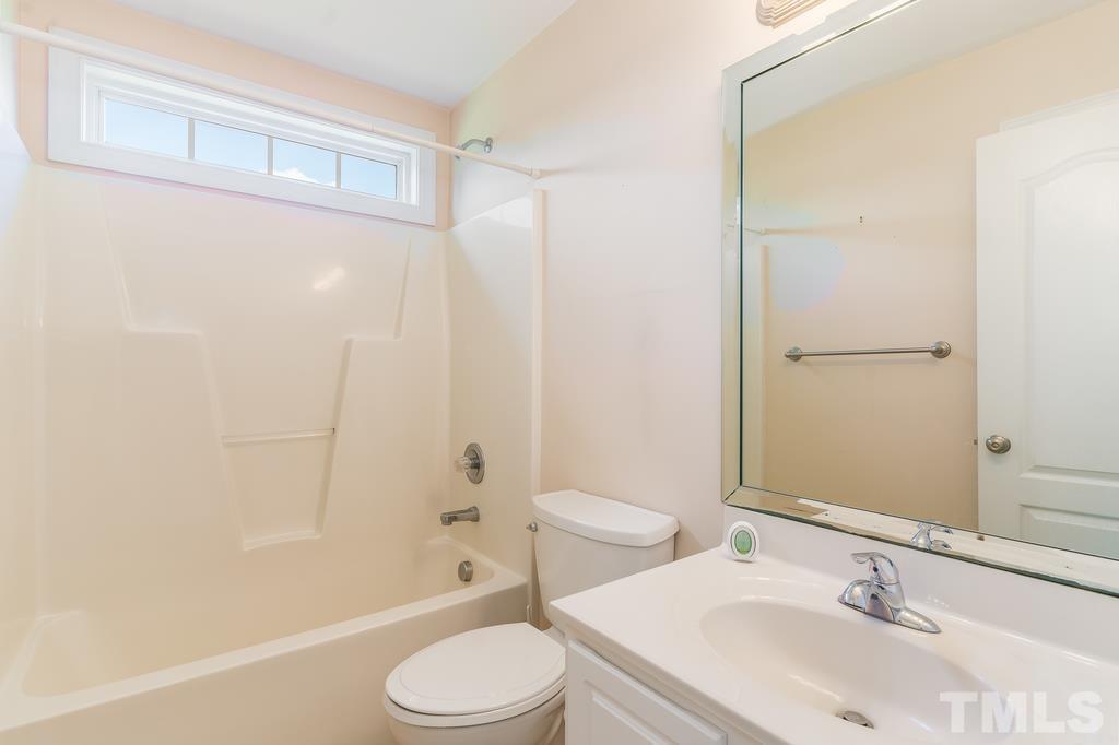 5016 Contender Drive Raleigh, NC 27603 - Photo 7 of 29 a bathroom with a sink toilet and shower