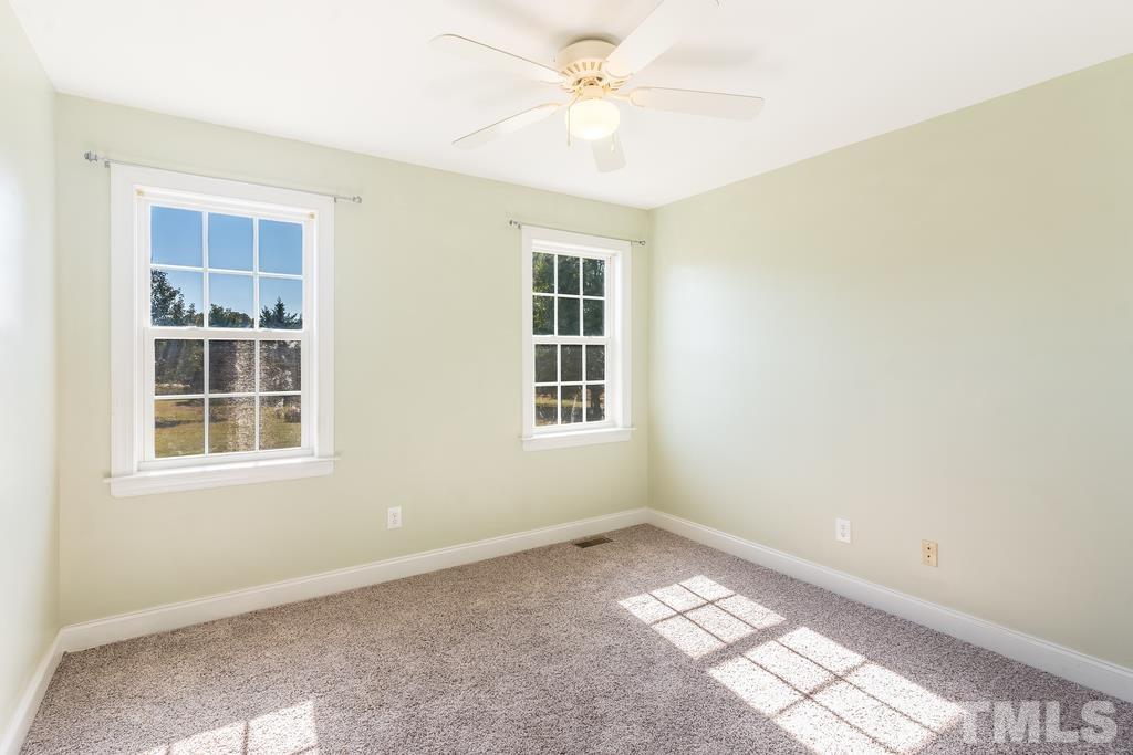 5016 Contender Drive Raleigh, NC 27603 - Photo 8 of 29 an empty room with windows and entrance