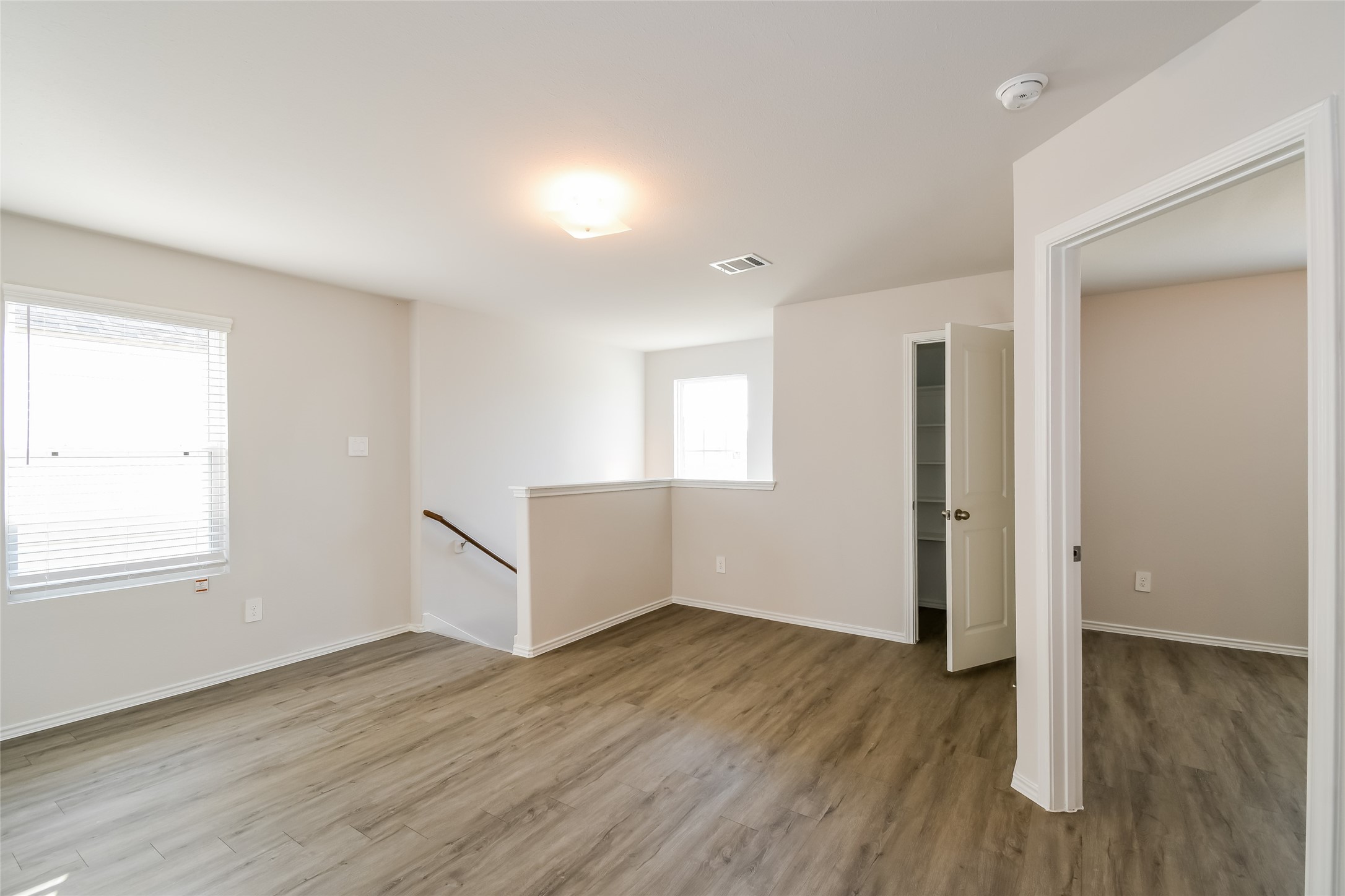 4931 Giant Sequoia Way Spring, TX 77373 - Photo 6 of 16 an empty room with wooden floor and windows