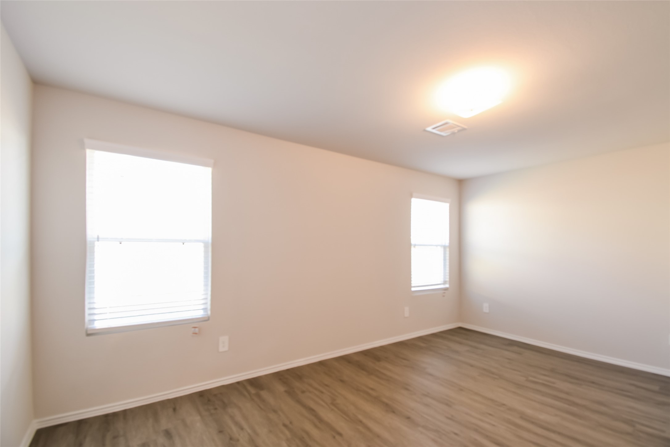 4931 Giant Sequoia Way Spring, TX 77373 - Photo 10 of 16 an empty room with wooden floor and windows