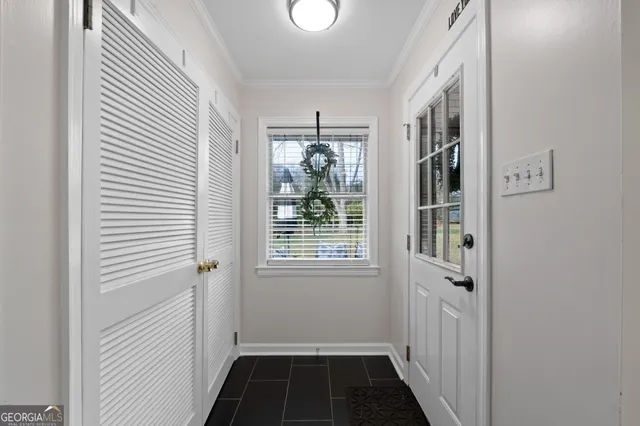 a view of a hallway with windows