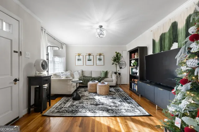 a living room with furniture and a flat screen tv