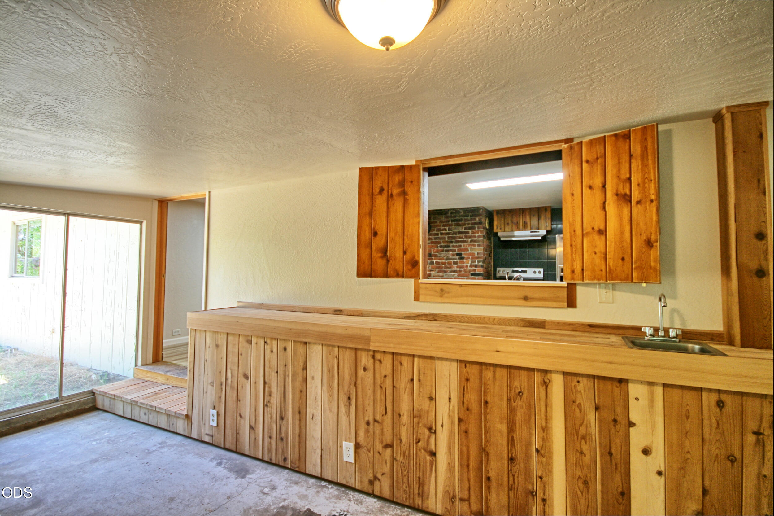 2525 Kinney Creek Road Jacksonville, OR 97530 - Photo 22 of 38 a view of a bedroom with wooden floor and a window