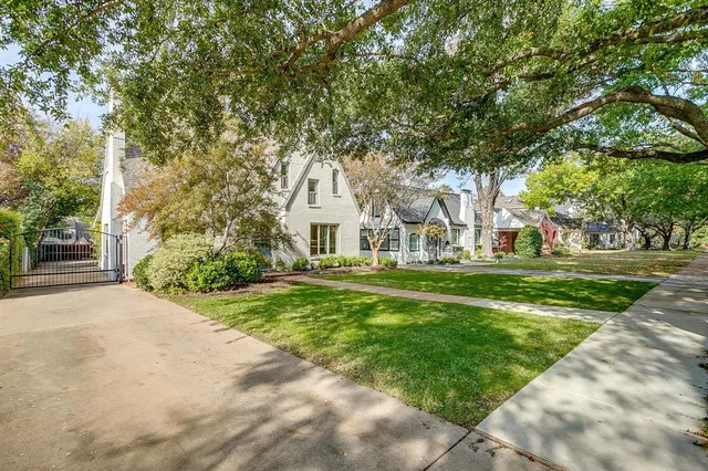 a view of house with yard and green space