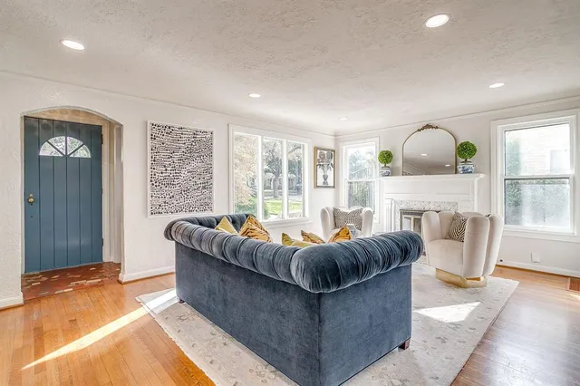 a living room with furniture and a fireplace