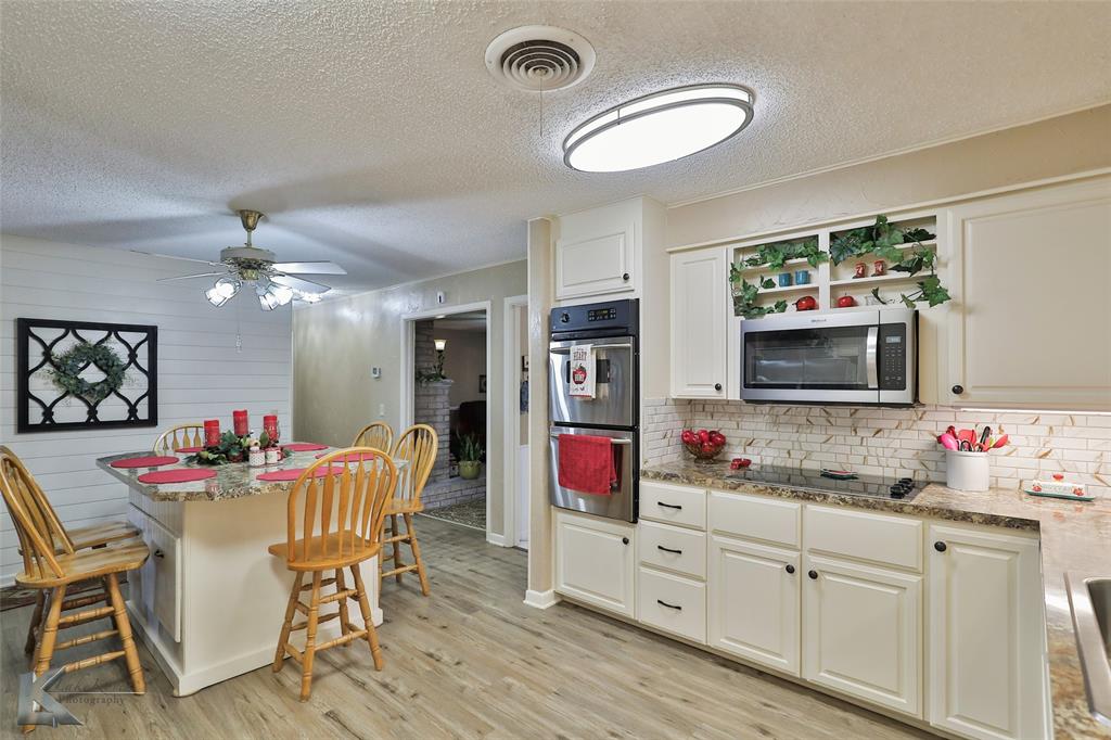 604 North 19th Street Haskell, TX 79521 - Photo 20 of 36 a view of a dining room with furniture and chandelier
