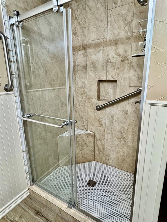 604 North 19th Street Haskell, TX 79521 - Photo 24 of 36 a bathroom with a glass shower door