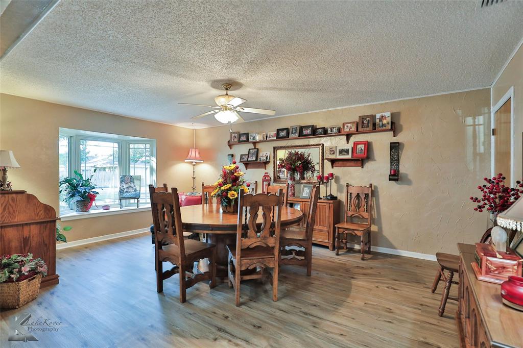 604 North 19th Street Haskell, TX 79521 - Photo 6 of 36 a view of a dining room with furniture and wooden floor