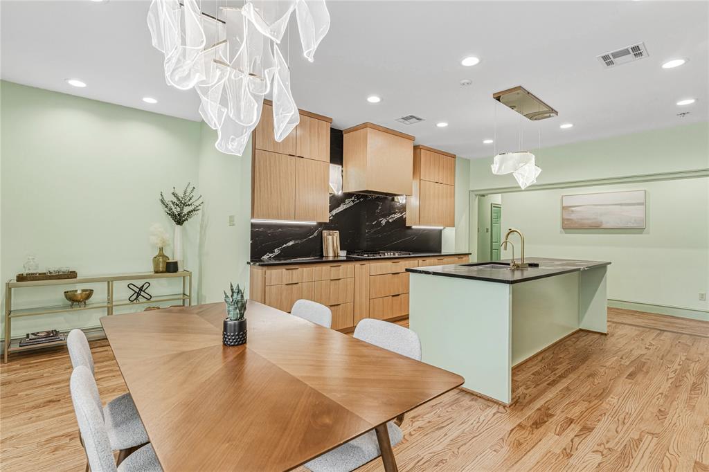 3201 Edward Drive Waco, TX 76708 - Photo 18 of 40 a large kitchen with kitchen island a stove a sink a dining table and chairs