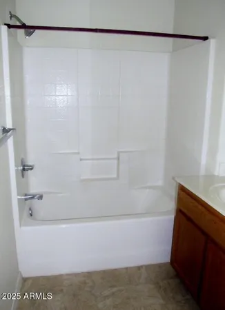 a view of an empty room and a window